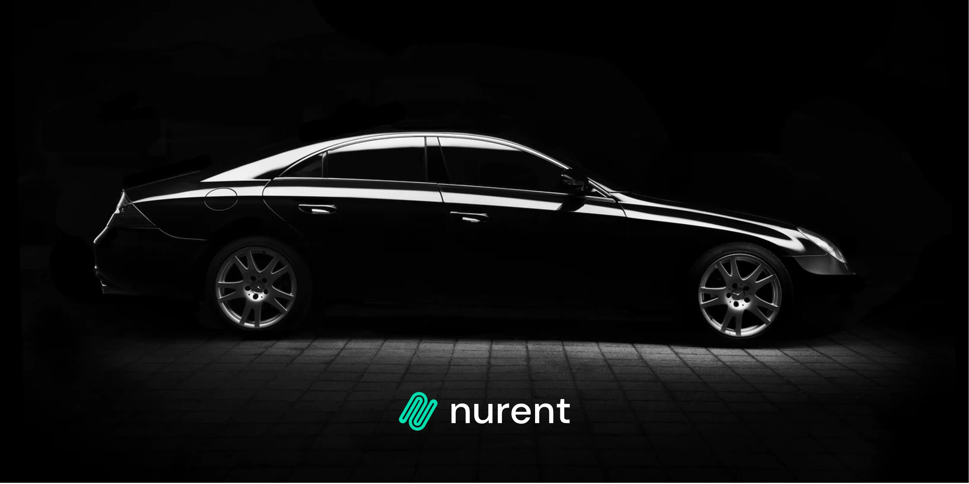 A premium black sedan lit in the dark under the Nurent wordmark, setting the upmarket rental promise